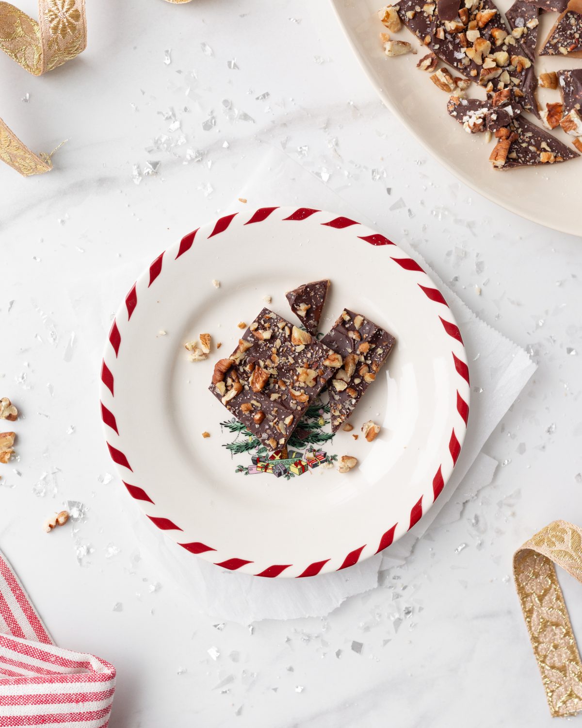 Chocolate Almond Toffee Bark on a Christmas plate.