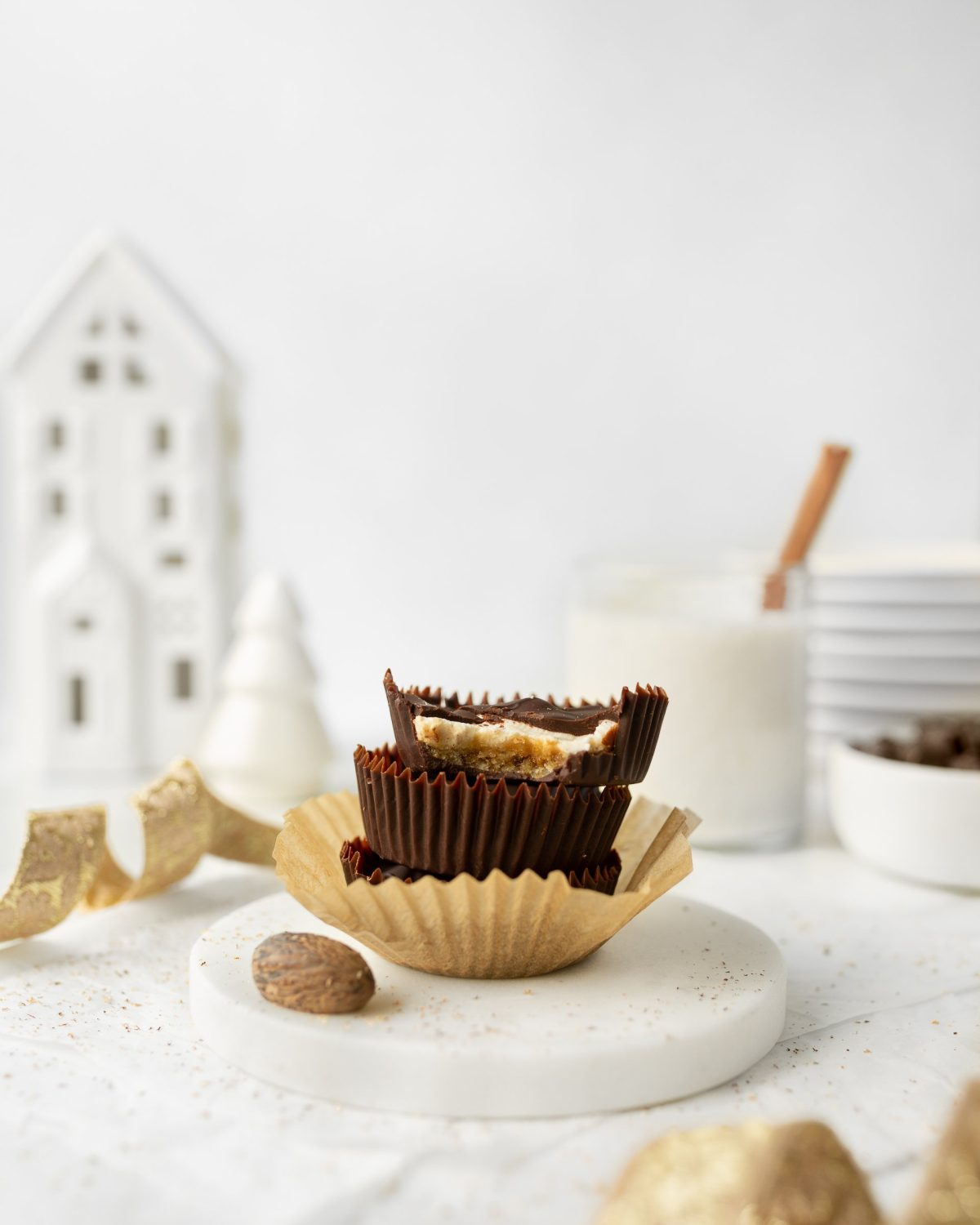 GF Chocolate-covered Eggnog Cheesecake Bites stacked (straight on)