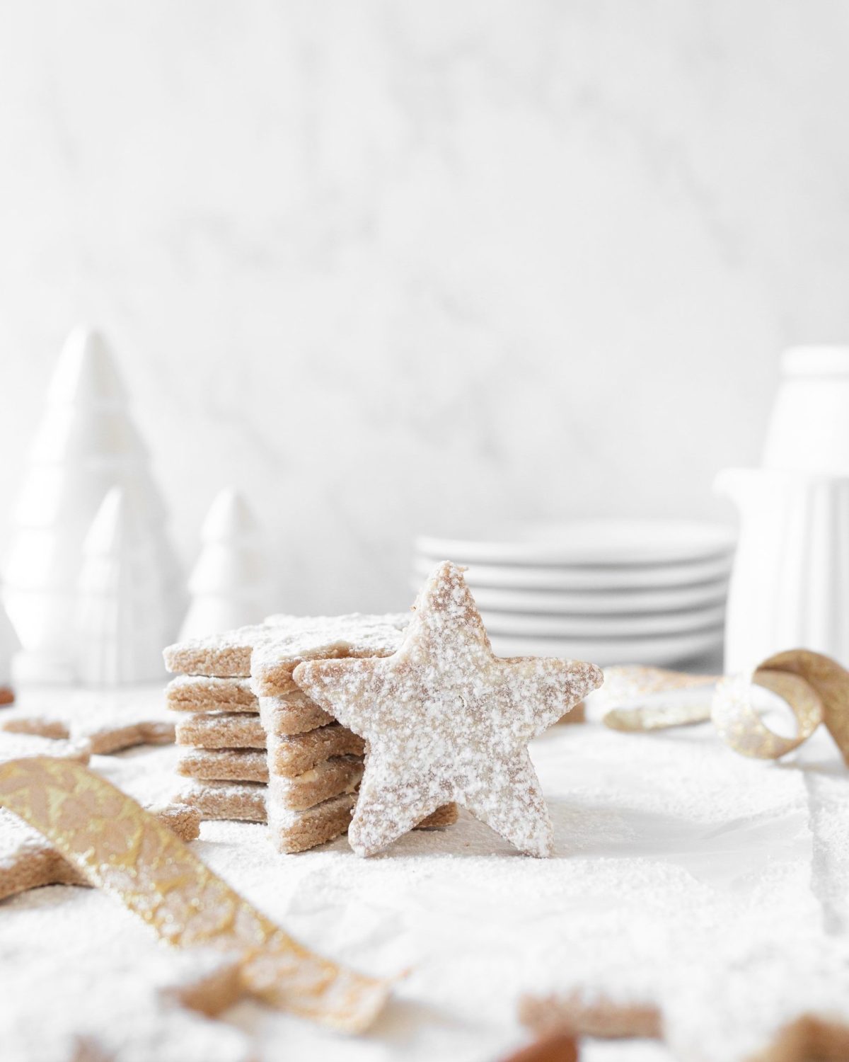 Zimtsterne: Cinnamon Star Cookies stacked on top of each other.