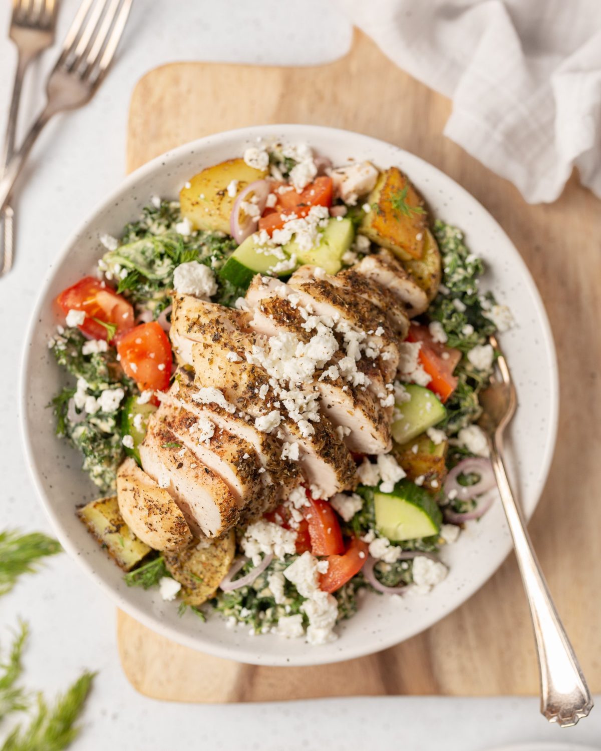 Mediterranean Chicken Salad with Creamy Hummus Dressing in a bowl (top down)