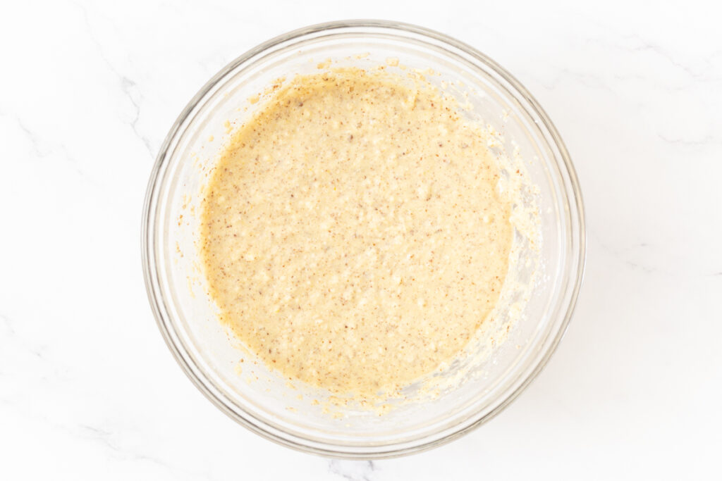 Process shot #2: Dry ingredients mixed into the same bowl with the wet ingredients, creating a muffin batter. 